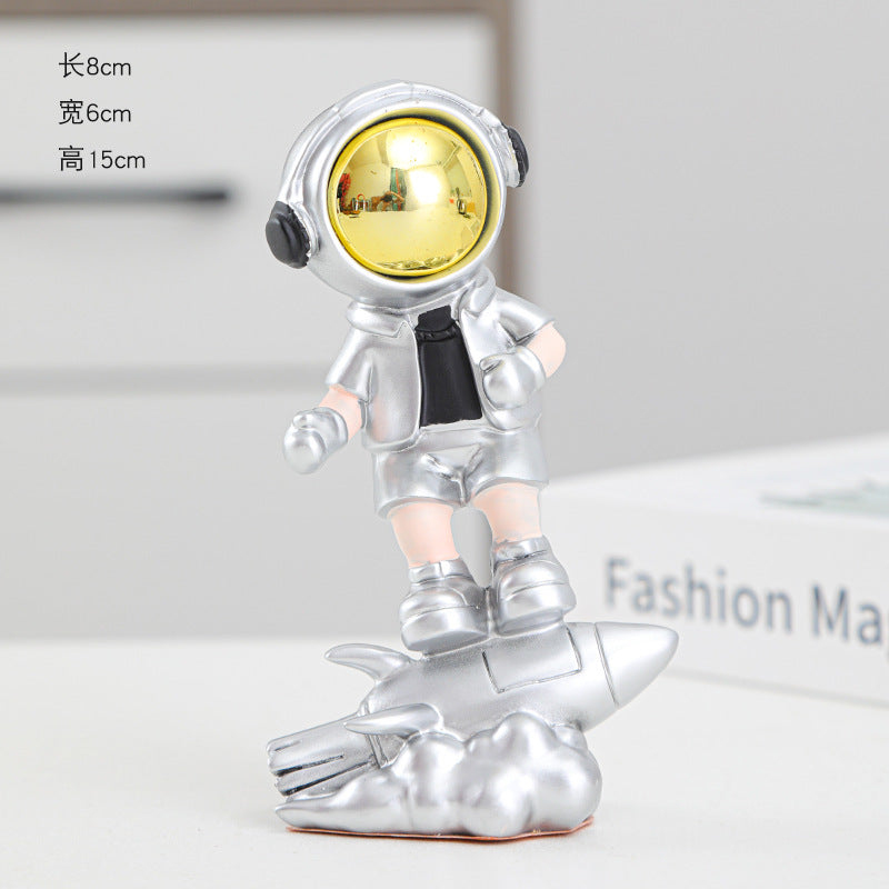 Astronaut On Rocket Figurine