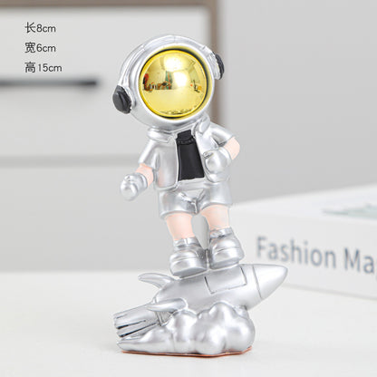 Astronaut On Rocket Figurine