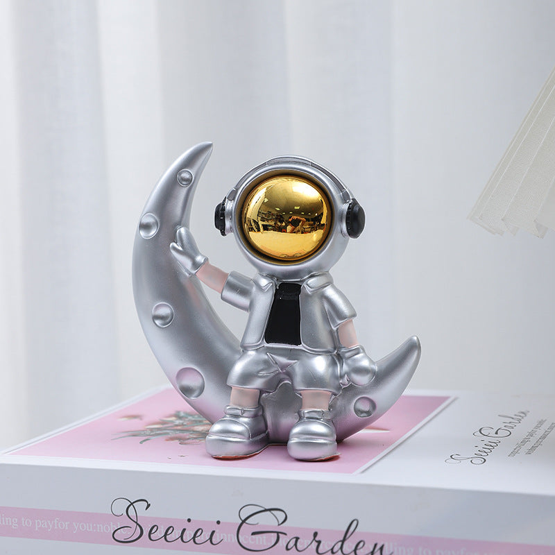 Astro Sitting on Moon Figurine
